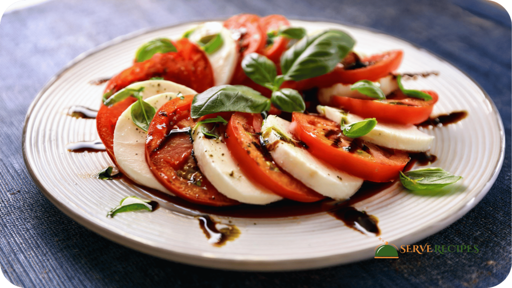 A Caprese salad with tomatoes, mozzarella, and basil drizzled with balsamic glaze, a light meal for quick dinner recipes.